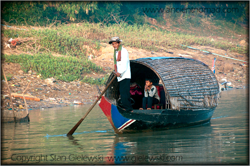 boat people of cambodia. oat carrying people.